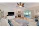 Inviting living area featuring a fireplace, ceiling fan, and patio access at 777 Hamlet Cir, Goose Creek, SC 29445
