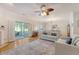 Open-concept living room with sliding doors and a fireplace at 777 Hamlet Cir, Goose Creek, SC 29445