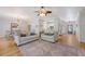 Open living space with sofas, hardwood floors, and dining area beyond at 777 Hamlet Cir, Goose Creek, SC 29445