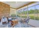 Bright sunroom with many windows providing view to large yard, featuring wicker furniture and lots of light at 777 Hamlet Cir, Goose Creek, SC 29445