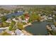 Breathtaking aerial view of home, nestled along a serene lake surrounded by lush greenery and established neighborhood at 79 Rivers Point, Charleston, SC 29412