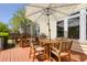 Exterior view of back deck, outdoor umbrella, grill, and outside seating at 79 Rivers Point, Charleston, SC 29412