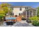 Large backyard with patio, hot tub, grill, screened in porch, and well-maintained lawn at 79 Rivers Point, Charleston, SC 29412