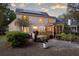 Charming backyard with patio, hot tub, screened porch, mature trees and solar panels on home at 79 Rivers Point, Charleston, SC 29412