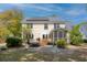 Spacious backyard showcasing a patio, hot tub, well-manicured lawn, and home's exterior at 79 Rivers Point, Charleston, SC 29412