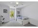 Charming bedroom with a twin bed and an abundance of natural light from a large window at 79 Rivers Point, Charleston, SC 29412