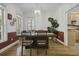 Bright dining room with natural light, hardwood floors, and a modern chandelier at 79 Rivers Point, Charleston, SC 29412