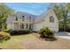 Charming home featuring manicured landscaping, a two-car garage, and a covered front porch at 79 Rivers Point, Charleston, SC 29412