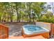 Backyard hot tub with wooded surroundings, offering a private and tranquil spa experience at 79 Rivers Point, Charleston, SC 29412