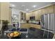 Modern kitchen featuring granite countertops, stainless appliances, and light wood cabinetry at 79 Rivers Point, Charleston, SC 29412