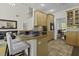 Modern open-concept kitchen with a kitchen island and adjacent living room at 79 Rivers Point, Charleston, SC 29412