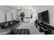 Spacious living room with a large leather couch and a wet bar for entertaining at 79 Rivers Point, Charleston, SC 29412
