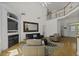 Comfortable living room with a fireplace, hardwood floors, high ceilings, and a loft view at 79 Rivers Point, Charleston, SC 29412
