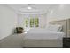 Serene main bedroom featuring a large window with natural light and plush carpeting at 79 Rivers Point, Charleston, SC 29412