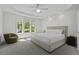 Serene main bedroom featuring a large window with natural light and plush carpeting at 79 Rivers Point, Charleston, SC 29412