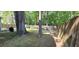 Large, fenced backyard with established trees and a storage shed at 8107 Old London Rd, North Charleston, SC 29406