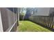 A well-maintained, fenced backyard with lush green grass at 8107 Old London Rd, North Charleston, SC 29406