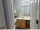 Bright bathroom area featuring vanity, lighting and a view into the other room at 8107 Old London Rd, North Charleston, SC 29406