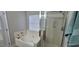 Bright bathroom with a soaking tub and glass enclosed shower at 8107 Old London Rd, North Charleston, SC 29406