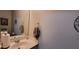 Cozy powder room featuring neutral walls, wall art, and a sink at 8107 Old London Rd, North Charleston, SC 29406