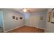Bedroom featuring wood flooring, artwork, and an adjacent closet with white folding doors at 8107 Old London Rd, North Charleston, SC 29406