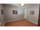 Spacious bedroom with neutral walls and wood floors at 8107 Old London Rd, North Charleston, SC 29406