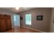 Cozy bedroom featuring neutral walls, hardwood flooring, and a window with natural light at 8107 Old London Rd, North Charleston, SC 29406