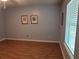 Bedroom featuring a window and hardwood floors, offering ample natural light at 8107 Old London Rd, North Charleston, SC 29406