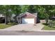 Charming single-story home featuring a brick facade, a well-maintained lawn, and an attached two-car garage at 8107 Old London Rd, North Charleston, SC 29406