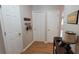 Hallway features hardwood flooring, decor, and multiple doorways to adjoining rooms at 8107 Old London Rd, North Charleston, SC 29406