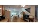 Bright kitchen and dining area with hardwood floors, a work space, and seamless flow for easy entertaining at 8107 Old London Rd, North Charleston, SC 29406