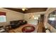 Inviting living room features hardwood floors, neutral walls, a ceiling fan, and comfortable leather furniture at 8107 Old London Rd, North Charleston, SC 29406