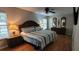 Main bedroom with a ceiling fan, tv, and ensuite at 8107 Old London Rd, North Charleston, SC 29406