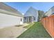 The backyard offers a patio, a fenced-in yard, and a view of the home at 83 Creekside Dr, Summerville, SC 29485
