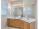 Main bathroom features double vanity, framed mirror and natural light at 83 Creekside Dr, Summerville, SC 29485