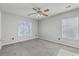 Spacious bedroom features neutral walls, carpeted floors, ceiling fan, and natural light at 83 Creekside Dr, Summerville, SC 29485