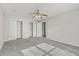 Bedroom with carpet, ceiling fan, and double bi-fold door closets at 83 Creekside Dr, Summerville, SC 29485