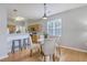 Eat-in kitchen dining area includes a round table, seating for four and modern lighting fixture at 83 Creekside Dr, Summerville, SC 29485