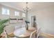 Inviting dining area with decorative art pieces, modern chair accents and chandelier at 83 Creekside Dr, Summerville, SC 29485