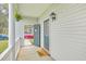 Charming front porch with an open door, a 'hello' mat, and a decorative wreath at 83 Creekside Dr, Summerville, SC 29485