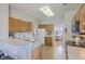 Traditional eat-in kitchen includes wood cabinets, laminate countertops, white appliances and adjacent dining room at 83 Creekside Dr, Summerville, SC 29485