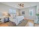 Main bedroom features hardwood floors, ceiling fan, and abundant natural light at 83 Creekside Dr, Summerville, SC 29485