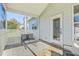 Outdoor screened porch with a seating area, outdoor rug, and view of the backyard at 83 Creekside Dr, Summerville, SC 29485