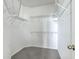 Empty walk-in closet features carpeted flooring and metal shelving at 83 Creekside Dr, Summerville, SC 29485