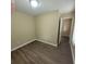 Cozy bedroom with hardwood floors, neutral walls, and natural light, perfect for relaxation at 9471 Netted Charm Ct, Ladson, SC 29456