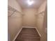 Walk-in closet has modern wood floors and features wire shelving for storage solutions at 9471 Netted Charm Ct, Ladson, SC 29456
