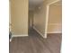 Inviting entryway with neutral walls and modern dark vinyl flooring, creating a warm welcome at 9471 Netted Charm Ct, Ladson, SC 29456