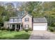Charming two-story home with brick and siding, a well-manicured lawn, and a two-car garage at 9471 Netted Charm Ct, Ladson, SC 29456