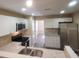 Modern kitchen featuring white cabinets, stainless steel appliances, and elegant granite countertops at 9471 Netted Charm Ct, Ladson, SC 29456