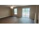 Open living room with wood floors and natural light, providing a comfortable and inviting space at 9471 Netted Charm Ct, Ladson, SC 29456